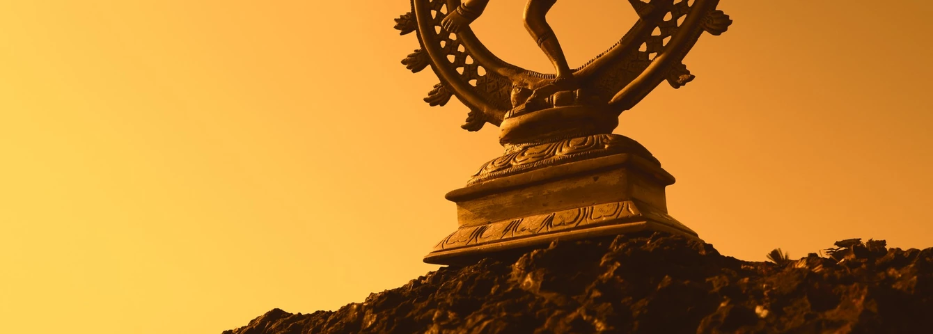 Nataraja statue at sunset