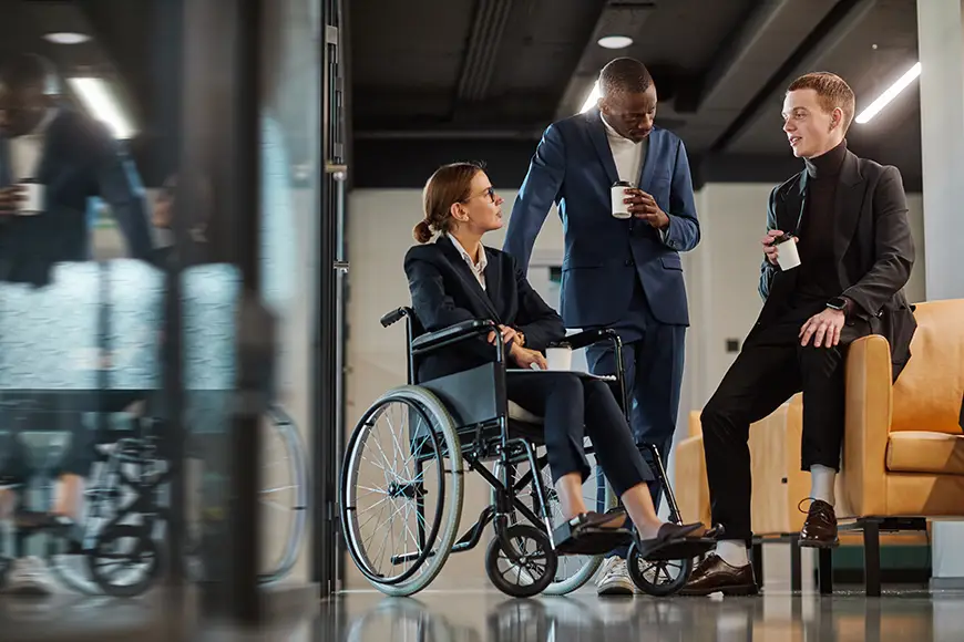 Diverse businesspersons chatting in a communal area