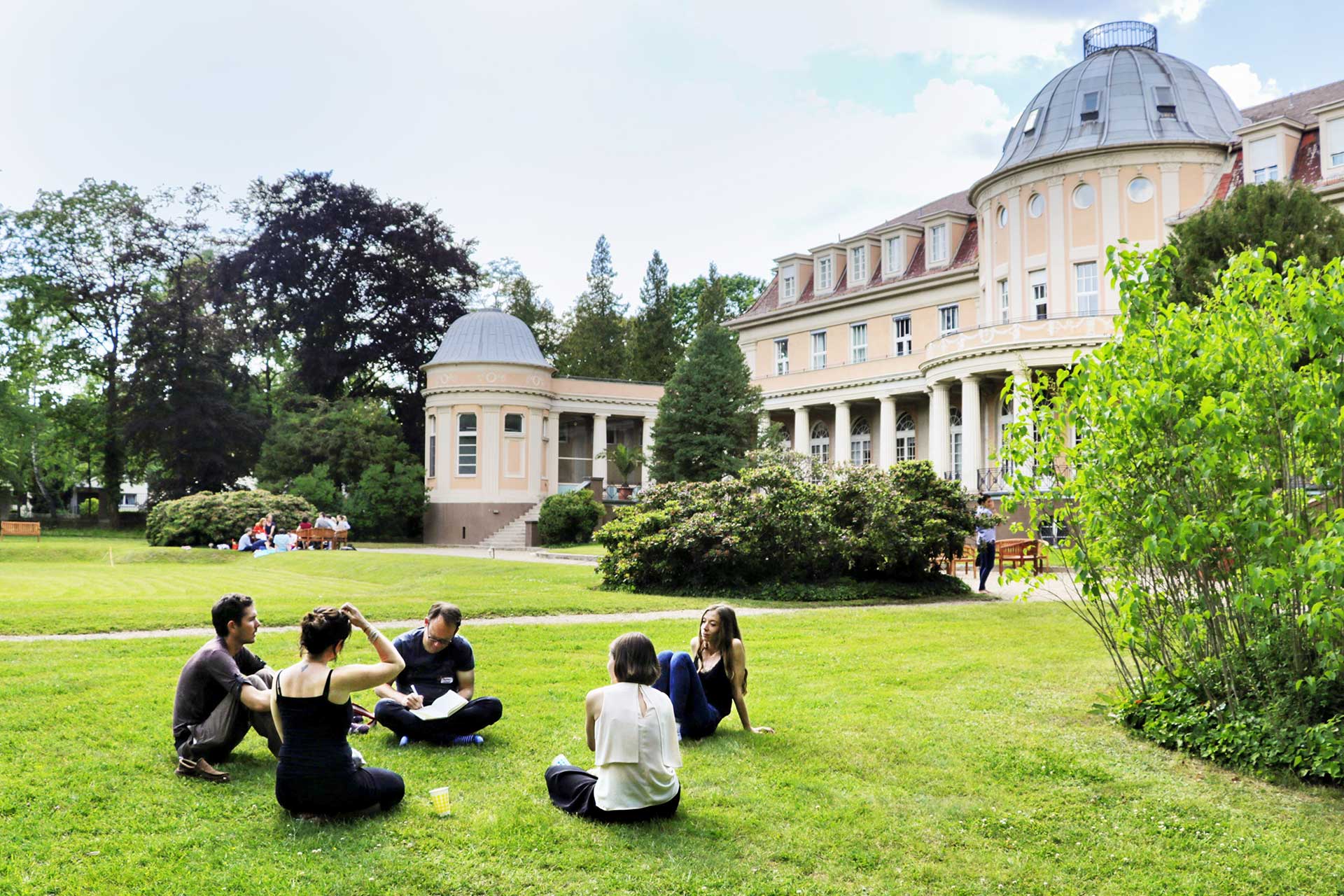 integral practitioners sit outside during a convergence